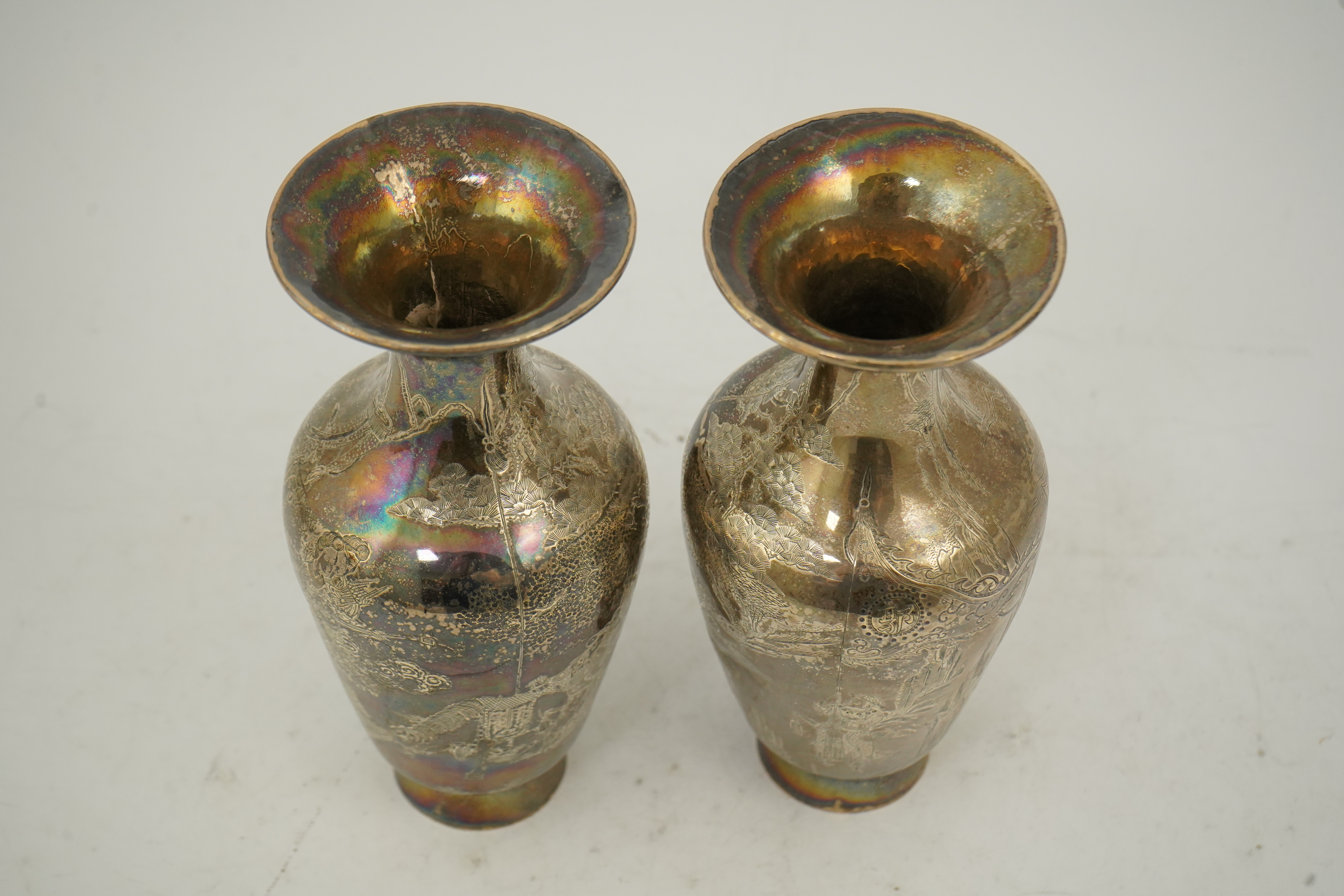 A pair of Chinese silver ‘immortals’ vases, late 19th century